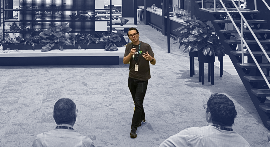Donny Yap presenting to an audience